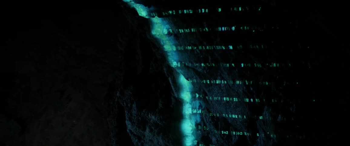 Lights are projected onto a cave wall