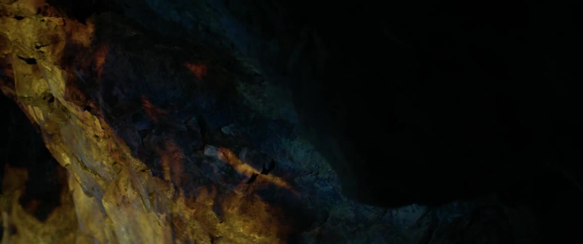 Reflection of fire on large rock