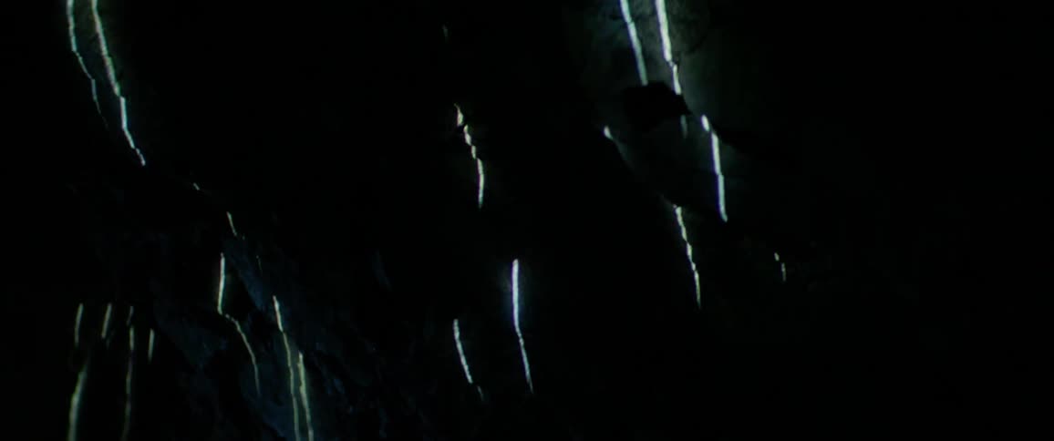 Lights are projected onto a cave wall