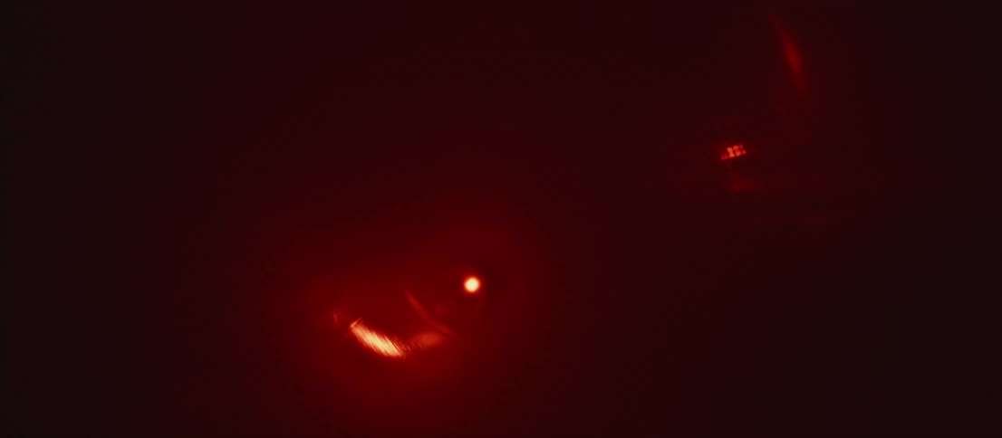 Glowing circles of varying sizes move in circular patterns