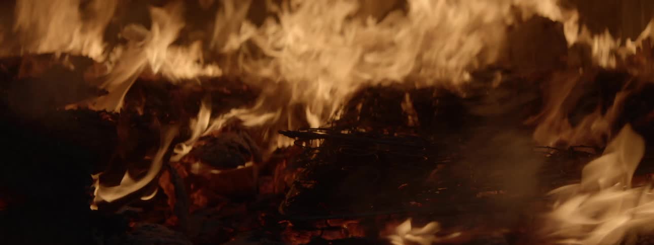 The bonfire is giving off heavy flames