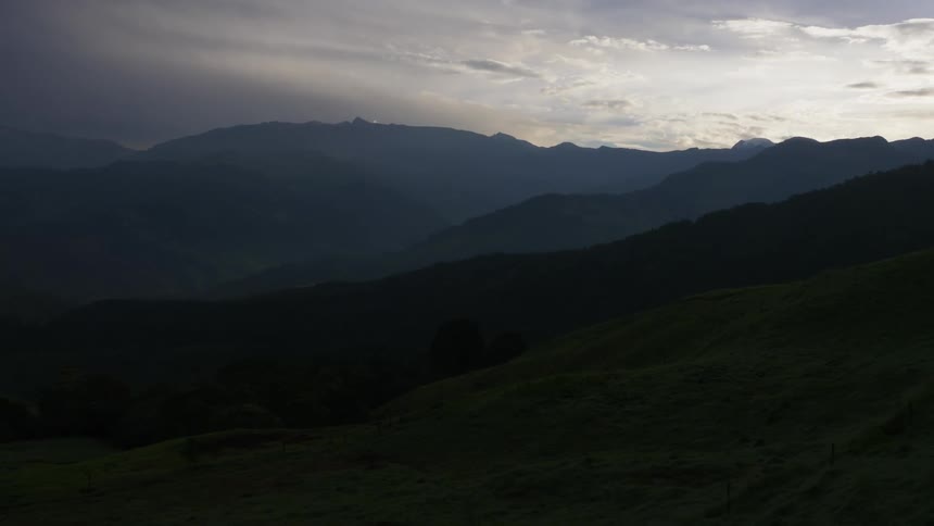 Aerial view of a landscape is displayed at dusk