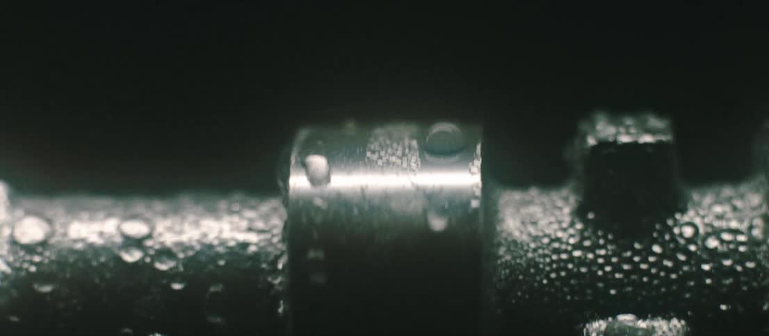 A metal pole with water on it rotating