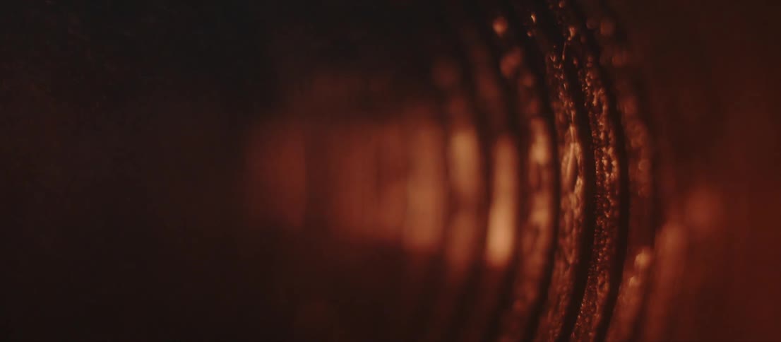 Steam flowing through the threaded interior of a cylindrical metallic tube