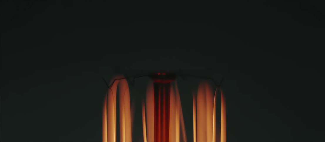 Black white and orange colors that look like a compact florescent light bulb