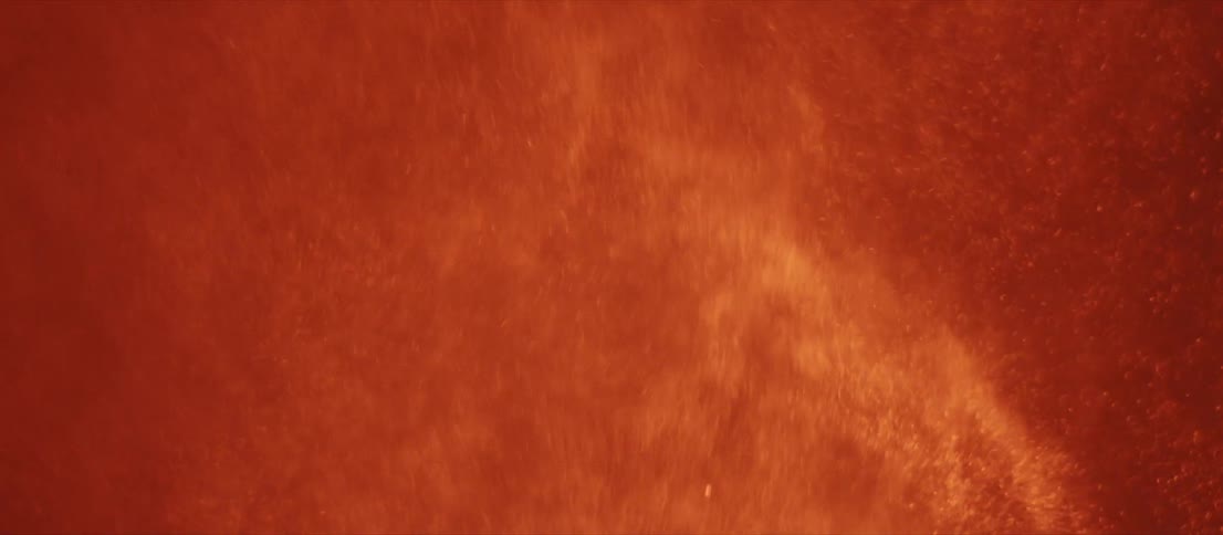 A view of a volcano erupting at night