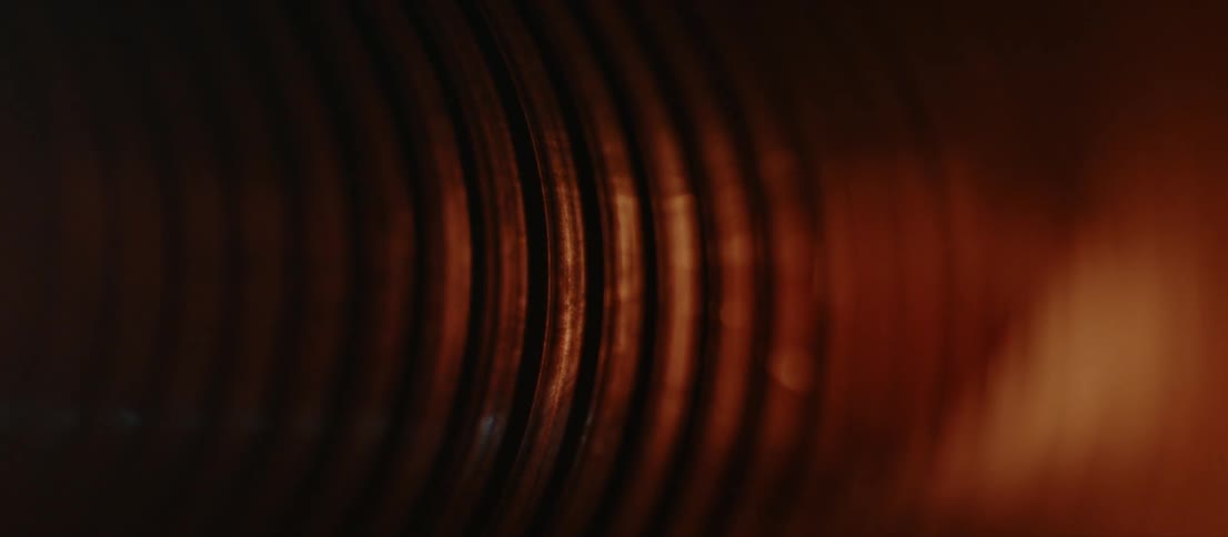 Light changes colors as it moves along wall of metal tunnel