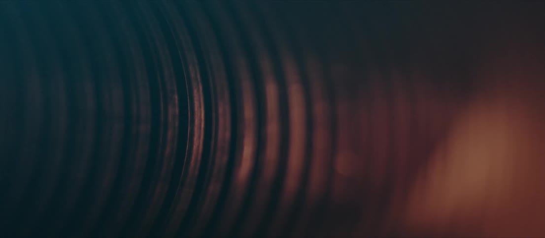 A light shining over a dark textured surface