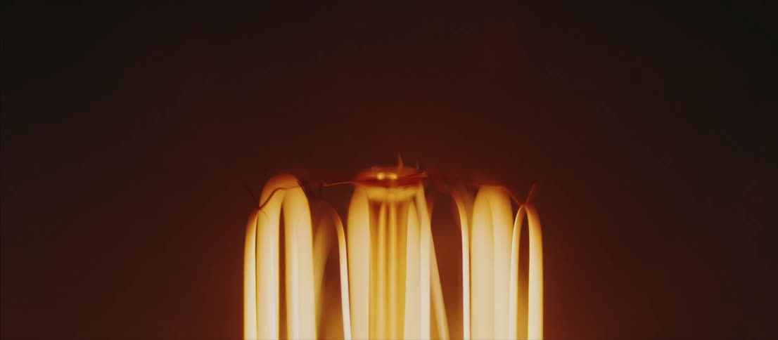 Gold curved lighting against a black background