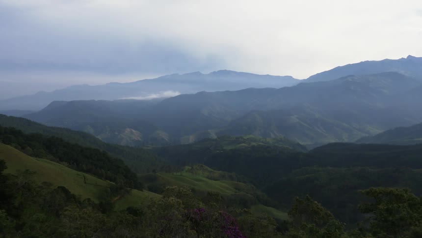 Aerial view of mountains and hills on a cloudy day