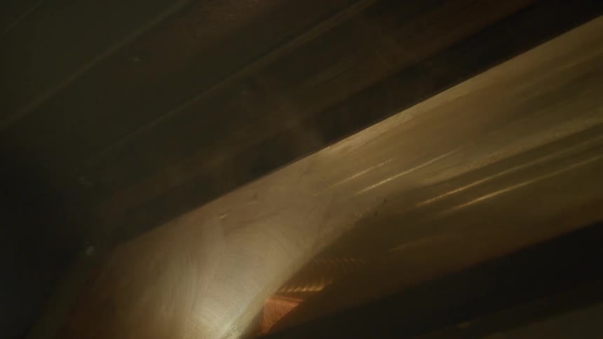 Smoke rises from an oven with a steamy glass