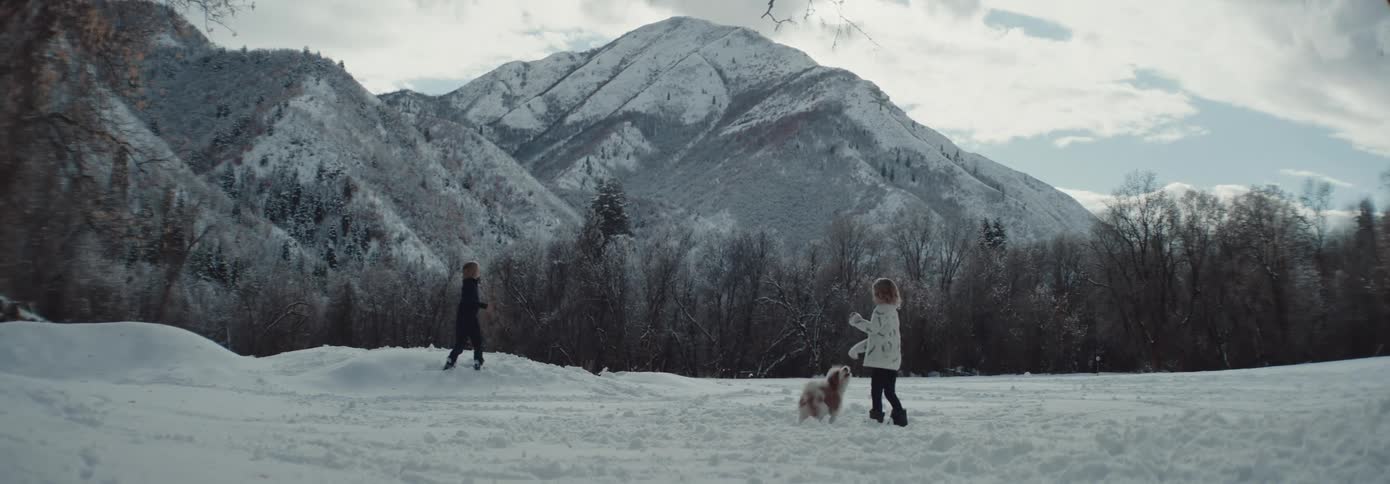 Two kids having a snowball fight