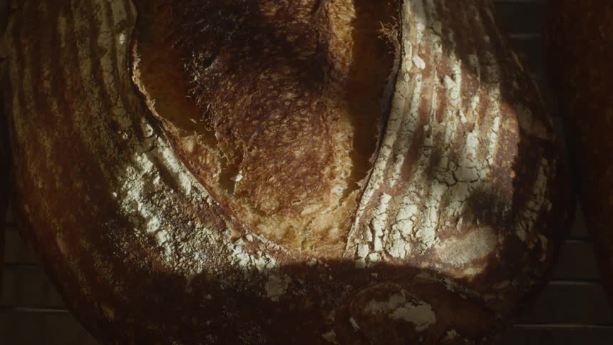 Brown crisp crust of a loaf of bread cooked at home