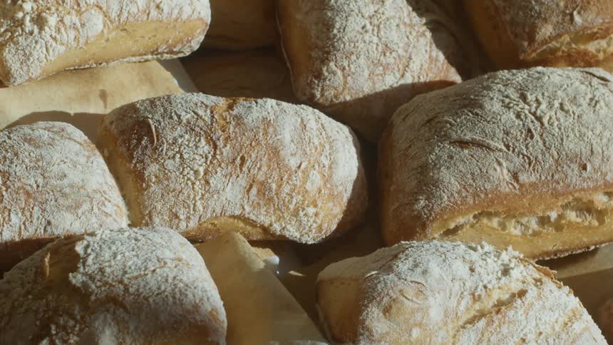 Baked bread covering a countertop