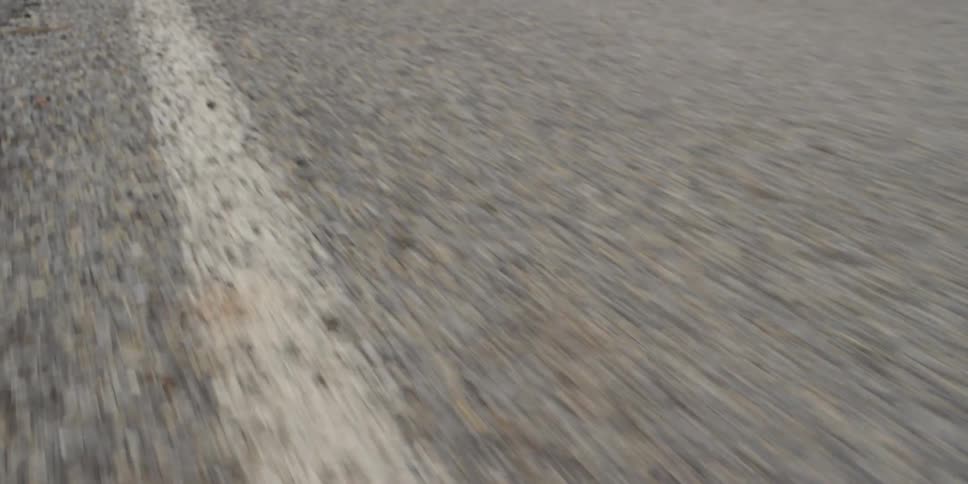Moving over a street with a white painted line