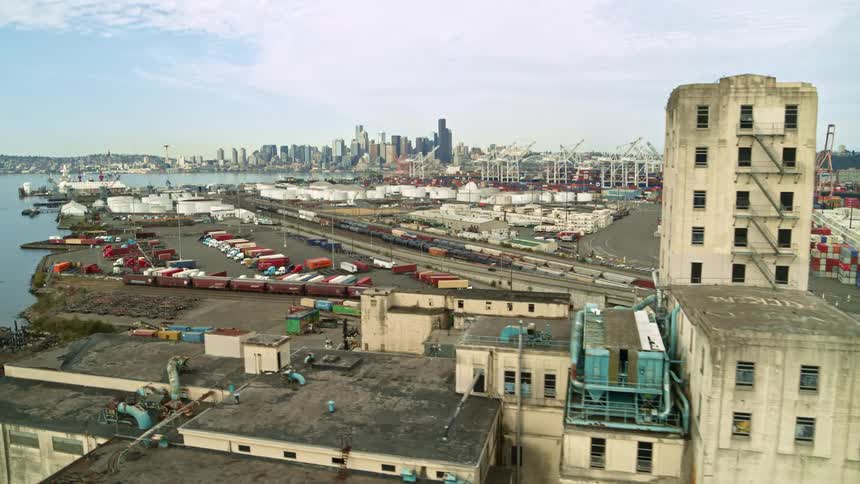 Revealing the Seattle skyline from behind the Harbor Island industrial area