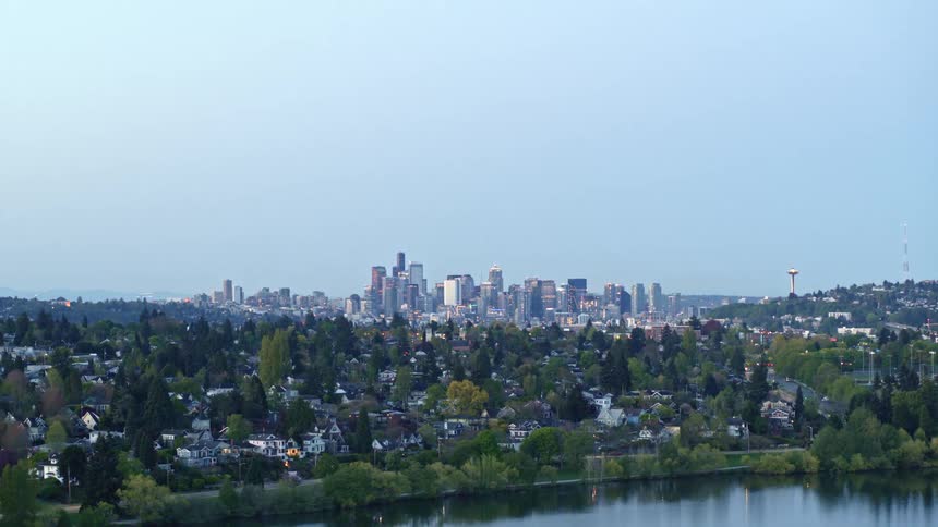 Ascending from low over Green Lake to reveal Lake Union and downtown Seattle