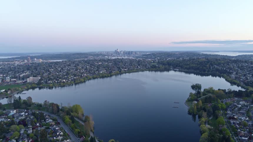 Rising over the Green Lake neighborhood to a wide overview of the entire Seattle metro area