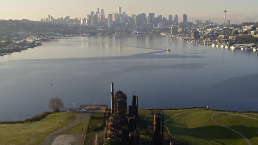 Flying over Gas Works Park to reveal Lake Union and the Seattle skyline at sunrise