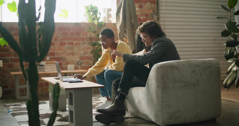 Man and woman are talking together and sitting indoors