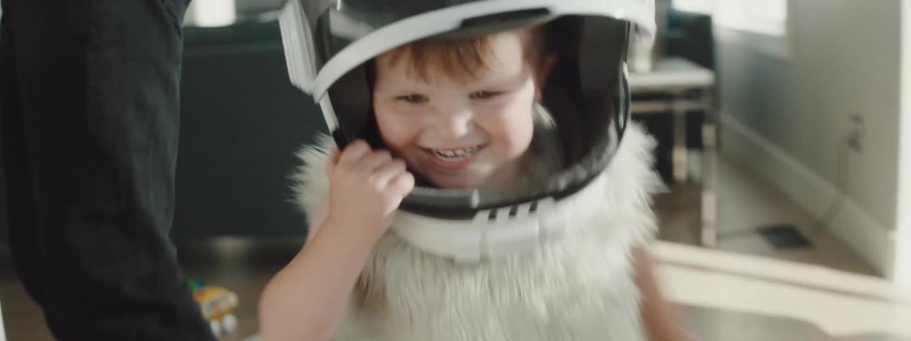 A toddler is running and playing indoors
