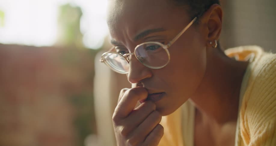 Young woman wearing glasses working at home