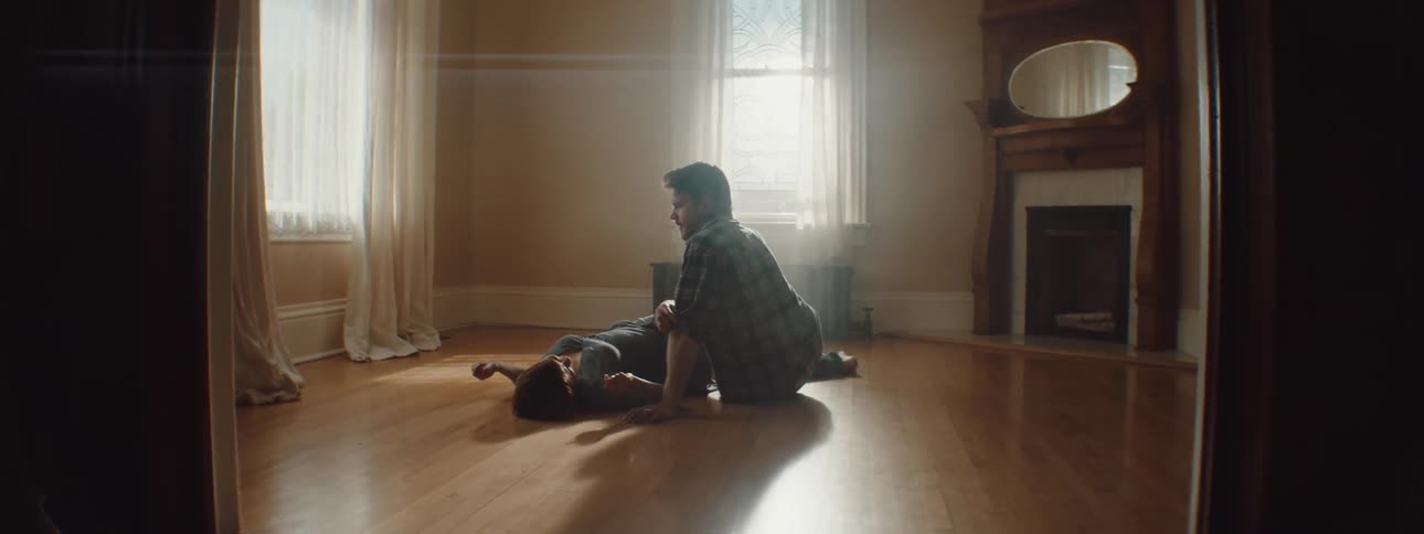 A man and woman laying around resting