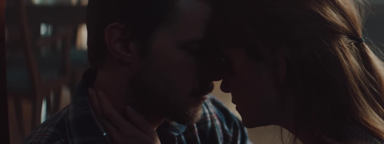 Husband and wife are sitting in a room together