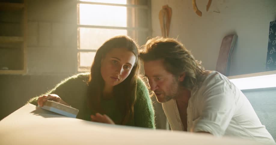 Man and woman are in a garage and cleaning furniture