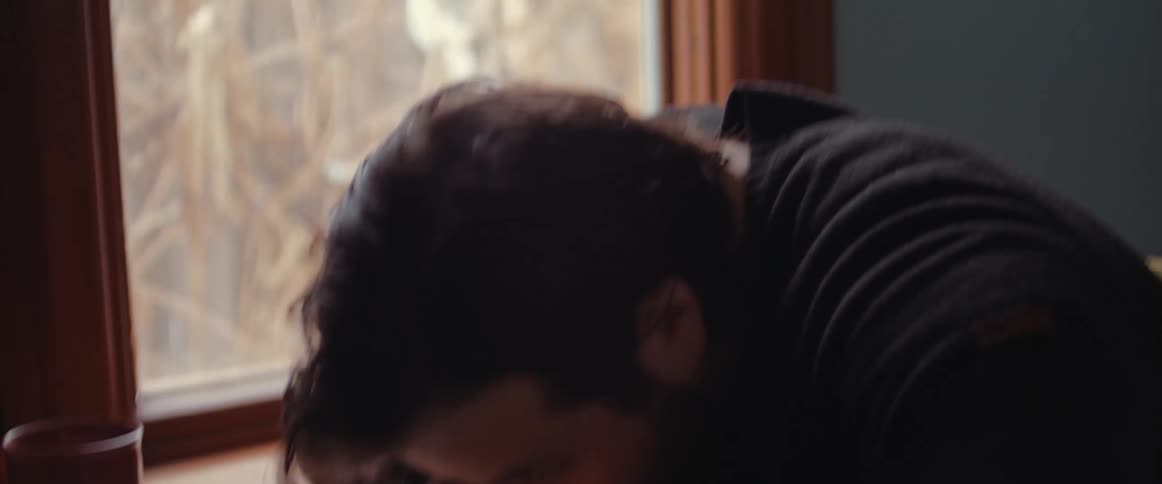 Sad nervous man sitting at home closes a laptop and stands up