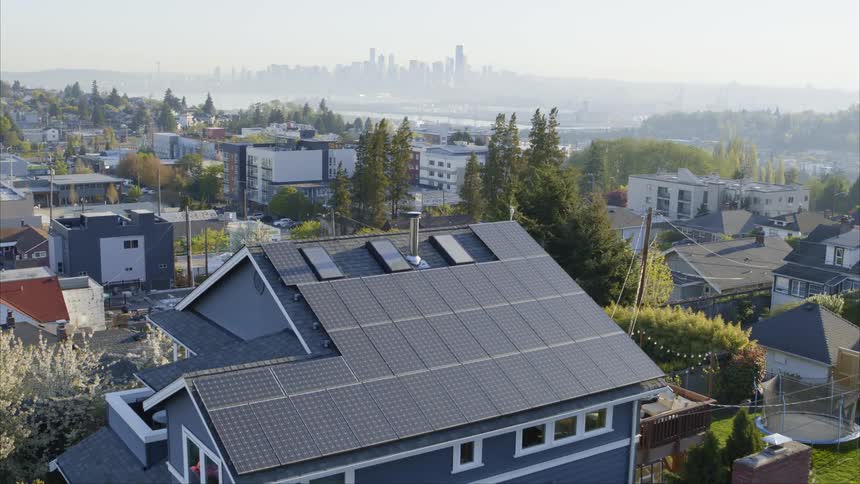Pullback reveal of an upscale urban home powered by solar energy