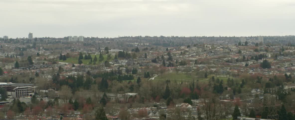 Aerial view of a city with houses is displayed in spring