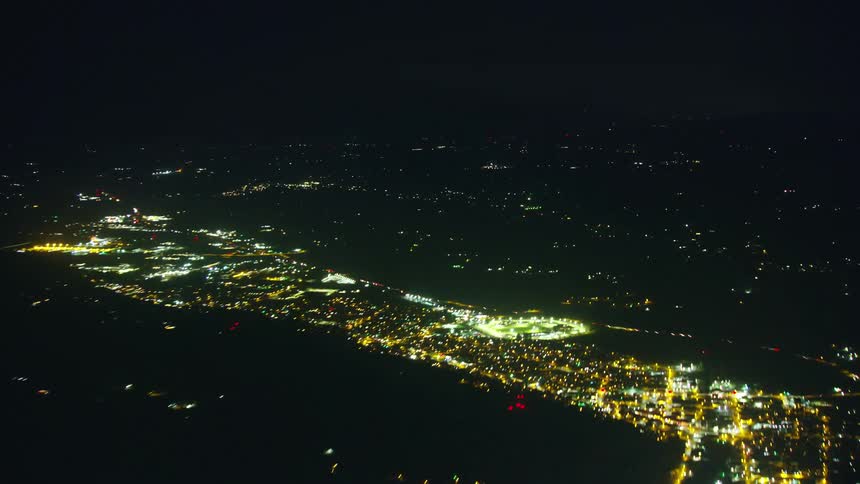 Night time lapse aerial of traffic rapidly driving into Portland Oregon on Interstate 5 at night from high above