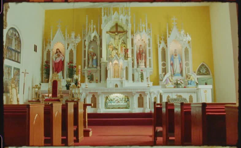 Rows of pews in front of the altar in a chapel