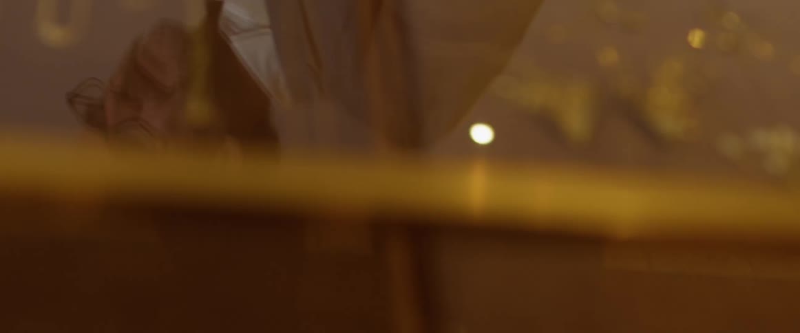 The reflection of a man and woman on glass
