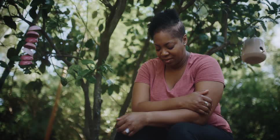A woman is resting in the yard