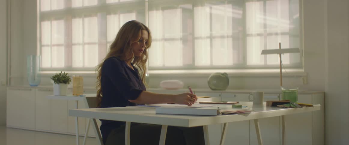 A woman sits in an office and works