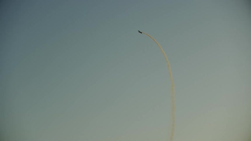 The single engine airplane starts a steep climb above a river and then ascends high into the sky before returning back to level flight