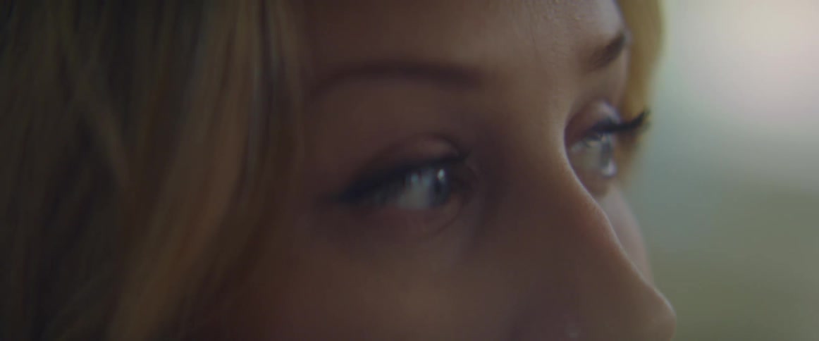 Side view of blonde womans eyes looking around