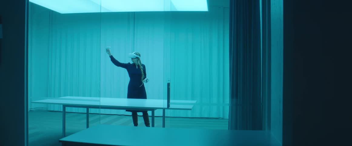 A woman playing with a vr setup
