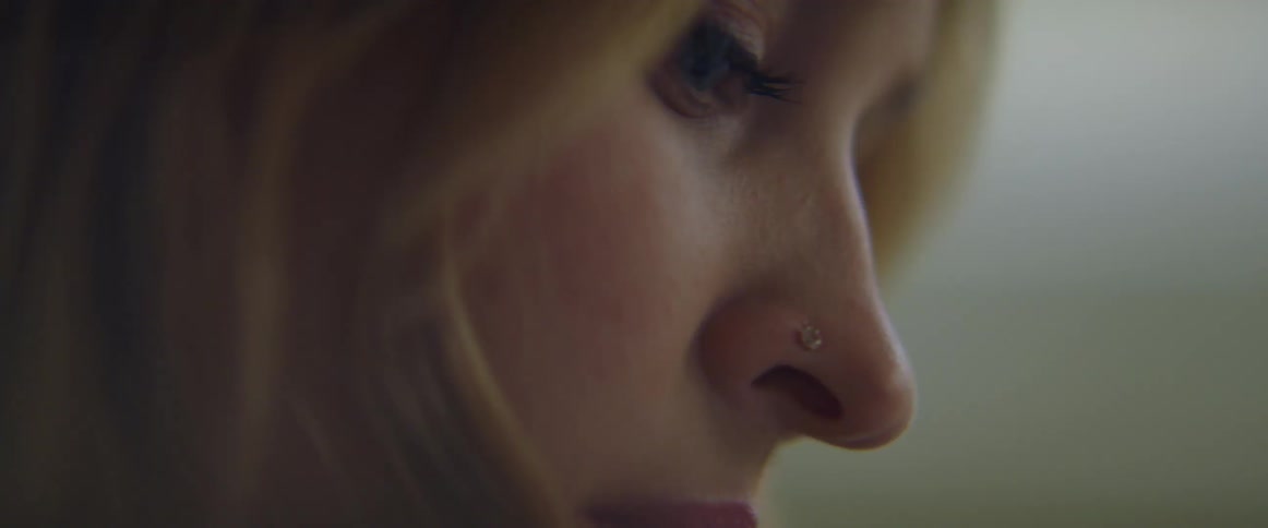 Close up of the face of a blonde woman