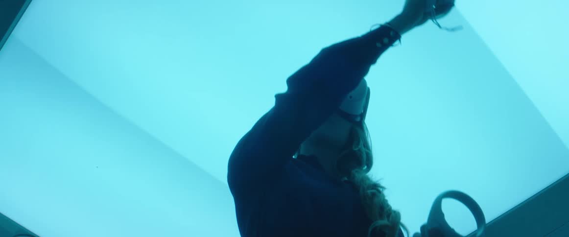 A woman plays a virtual reality game