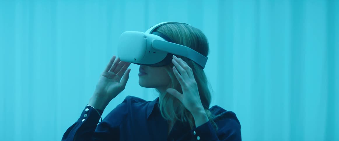 A woman putting on a vr headset