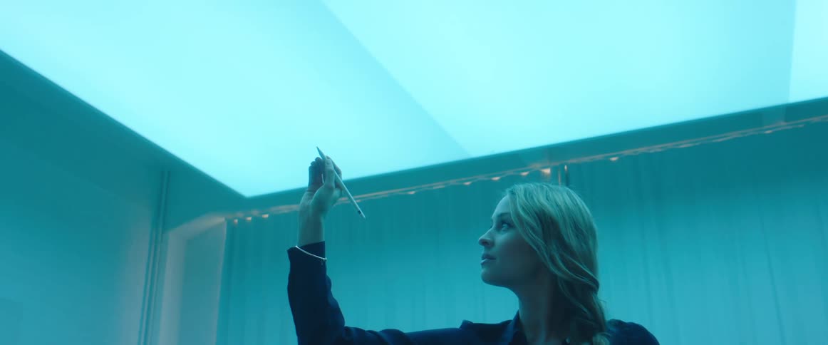 Woman drawing on the air using a stylus