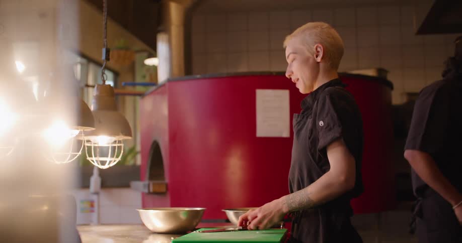 A chef cooking in a kitchen at a restaurant