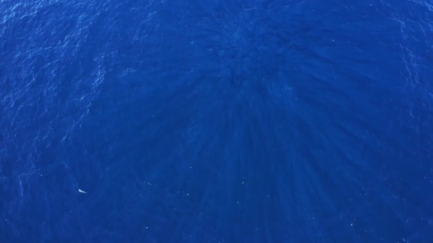 Aerial view of the suface of the blue ocean waters