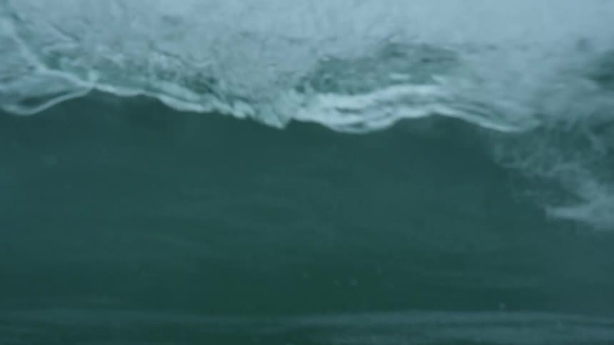 Wave splashes and rolls overhead