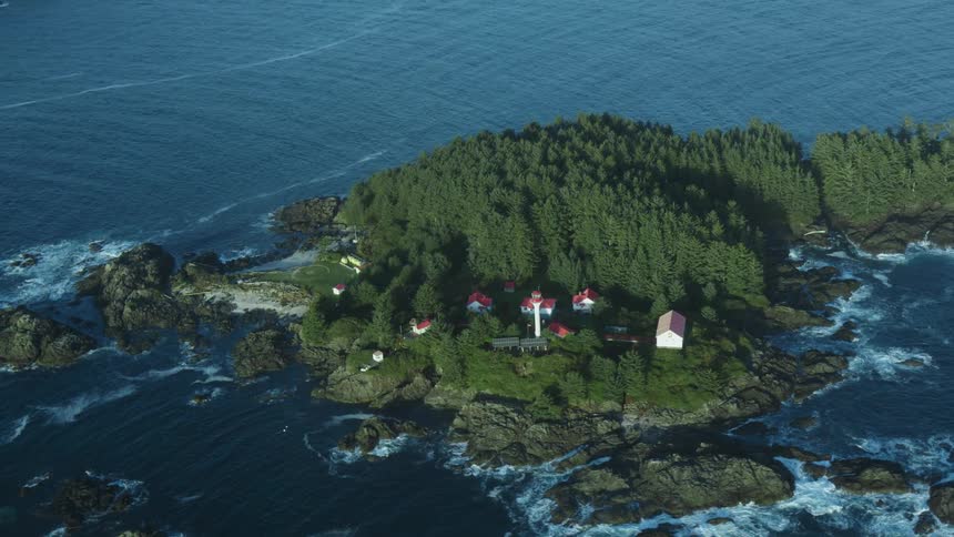 Light house on a small island in the coast