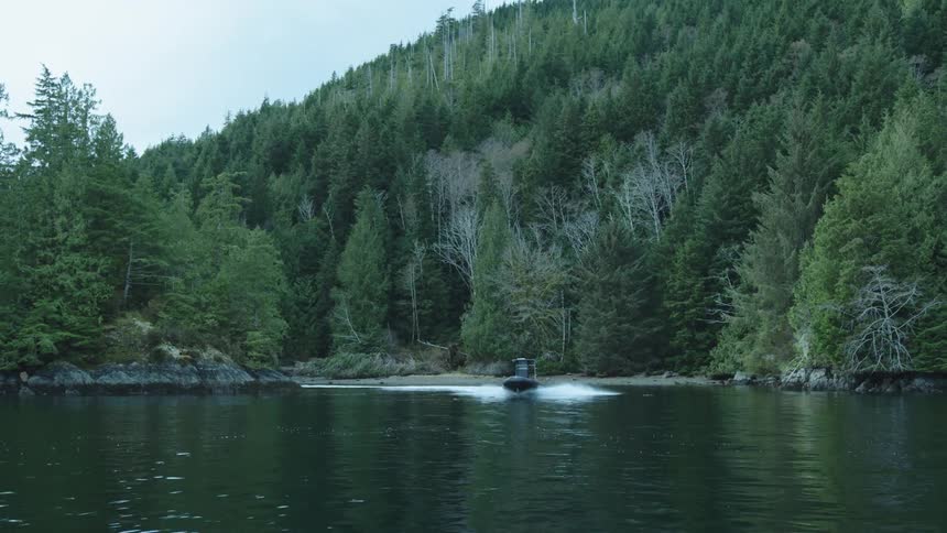A person is riding in their boat in the water