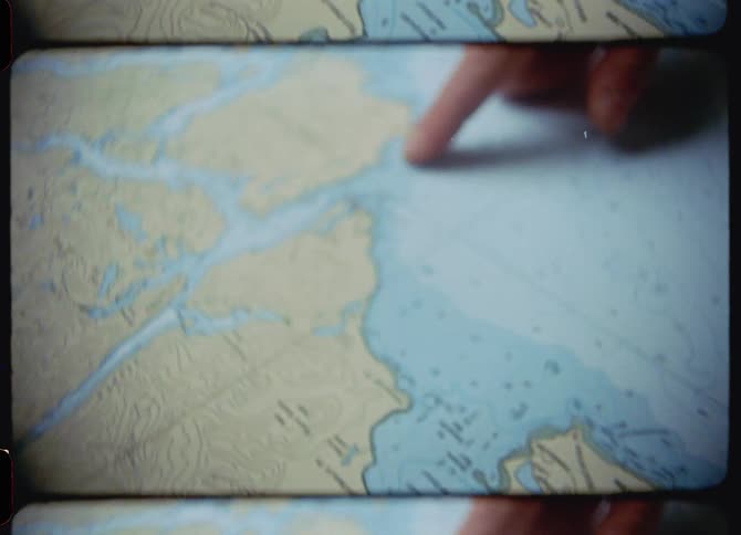 A person pointing at a map